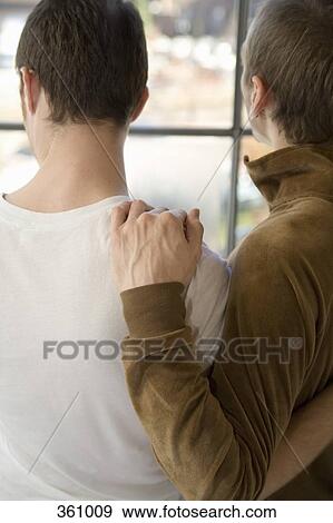 Two gay men looking through window View Large Photo Image Stock Photo - Two gay men looking through window. Fotosearch