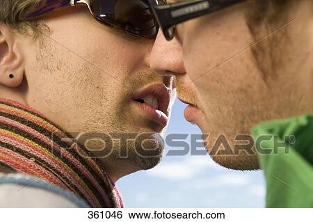Two men about to kiss View Large Photo Image Stock Photograph - Two men about to kiss. Fotosearch