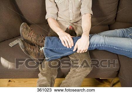 View of two homosexual men’s legs sitting on sofa View Large Photo Image Stock Image - View of two homosexual men’s legs sitting on sofa. Fotosearch
