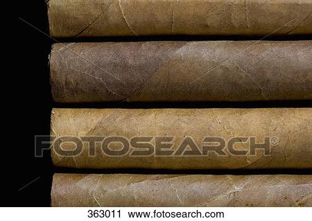 Four cigars side by side View Large Photo Image Stock Image - Four cigars side by side. Fotosearch