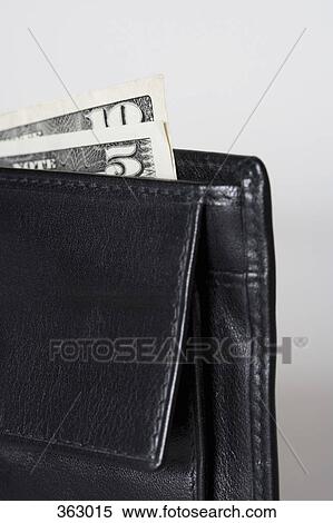 Wallet with US dollars poking out View Large Photo Image Stock Photography - Wallet with US dollars poking out. Fotosearch