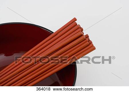 Stock Photo - Chopsticks in serving dish. Fotosearch