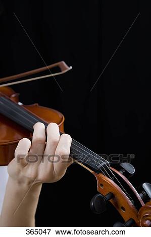 Detail of a woman playing the violin View Large Photo Image Stock Photo - Detail of a woman playing the violin. Fotosearch