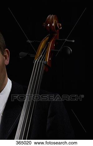 Detail of man playing the cello View Large Photo Image Stock Image - Detail of man playing the cello. Fotosearch