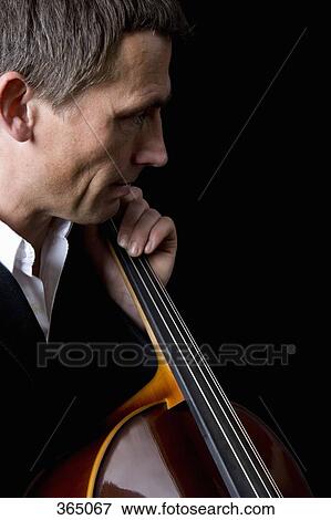 Man playing a cello View Large Photo Image Stock Photo - Man playing a cello. Fotosearch