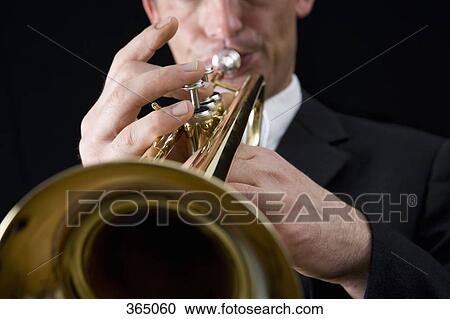 Man playing a trumpet View Large Photo Image Stock Image - Man playing a trumpet. Fotosearch