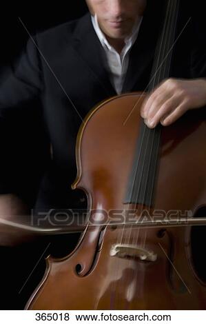 Stock Photo - Man playing the cello. Fotosearch