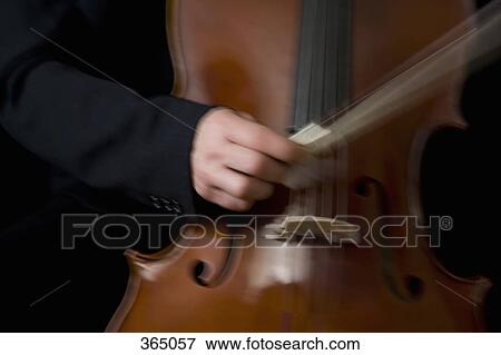Man playing the cello View Large Photo Image Stock Photo - Man playing the cello. Fotosearch