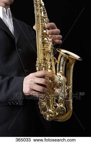 Man playing the saxophone View Large Photo Image Stock Image - Man playing the saxophone. Fotosearch
