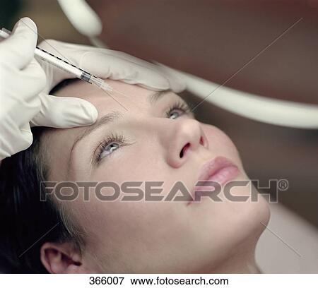 Woman receiving a Botox injection View Large Photo Image Stock Photo - Woman receiving a Botox injection. Fotosearch