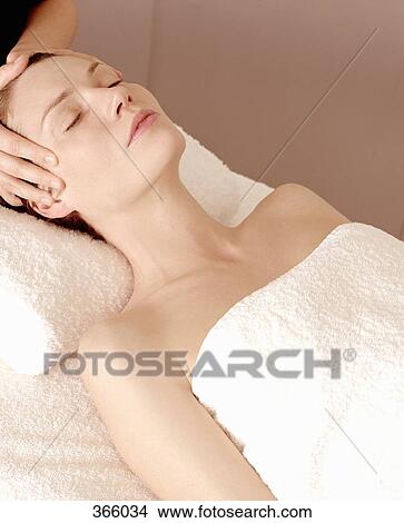 Woman receiving a massage at a beauty spa View Large Photo Image Picture - Woman receiving a massage at a beauty spa. Fotosearch