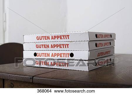 Picture - Stacked pizza boxes on table. Fotosearch