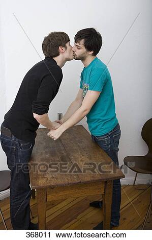 Stock Image - Two gay men kissing. Fotosearch