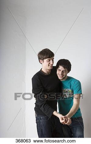 Young gay couple dancing together View Large Photo Image Stock Image - Young gay couple dancing together. Fotosearch