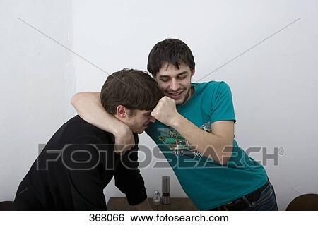 Young men play fighting View Large Photo Image Stock Photograph - Young men play fighting. Fotosearch