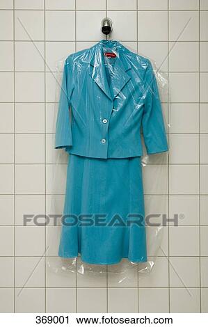 Dry cleaned suit hanging in a shower View Large Photo Image Stock Image - Dry cleaned suit hanging in a shower. Fotosearch