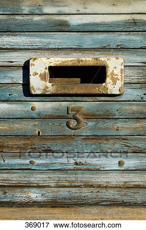 Mail slot on wooden panel View Large Photo Image Stock Photo - Mail slot on wooden panel. Fotosearch