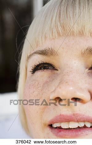 Close-up of young woman looking up View Large Photo Image Stock Image - Close-up of young woman looking up. Fotosearch