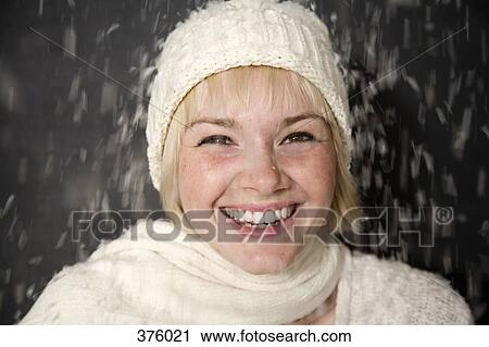 Snow falling on young woman View Large Photo Image Stock Image - Snow falling on young woman. Fotosearch