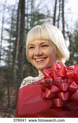 Young woman wrapped in wrapping paper View Large Photo Image Stock Image - Young woman wrapped in wrapping paper. Fotosearch