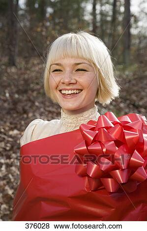 Young woman wrapped in wrapping paper View Large Photo Image Stock Photo - Young woman wrapped in wrapping paper. Fotosearch