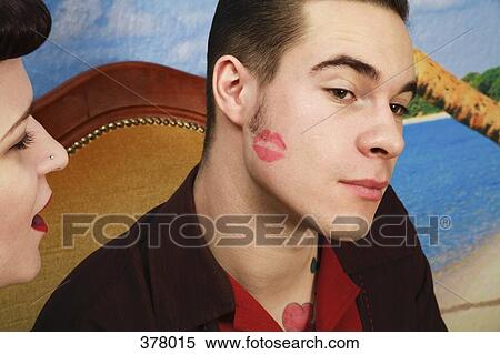 Lipstick kiss on cheek of young rockabilly man View Large Photo Image Stock Photography - Lipstick kiss on cheek of young rockabilly man. Fotosearch