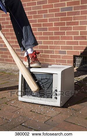 Man holding a baseball bat to a smashed monitor View Large Photo Image Stock Image - Man holding a baseball bat to a smashed monitor. Fotosearch