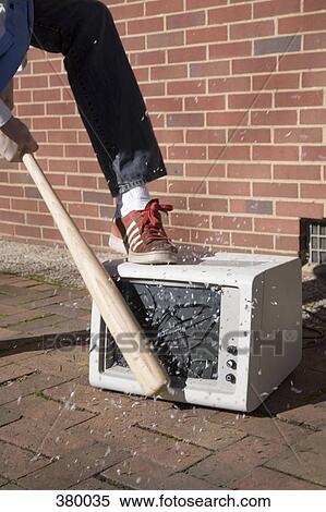 Man smashing a monitor with a baseball bat View Large Photo Image Stock Photography - Man smashing a monitor with a baseball bat. Fotosearch
