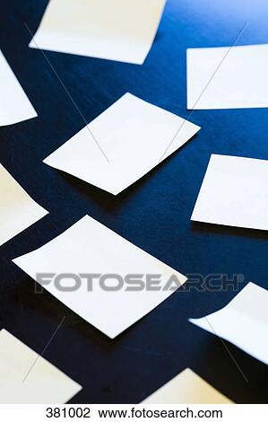 Stock Image - Adhesive notes stuck on desk. Fotosearch