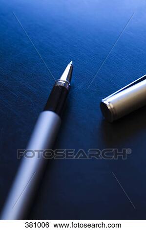 Ball point pen on a desk View Large Photo Image Stock Photograph - Ball point pen on a desk. Fotosearch