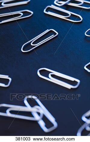 Group of paper clips on a desk View Large Photo Image Stock Image - Group of paper clips on a desk. Fotosearch