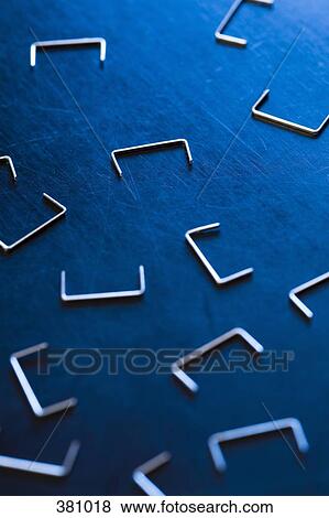 Loose staples on a desk View Large Photo Image Stock Photo - Loose staples on a desk. Fotosearch