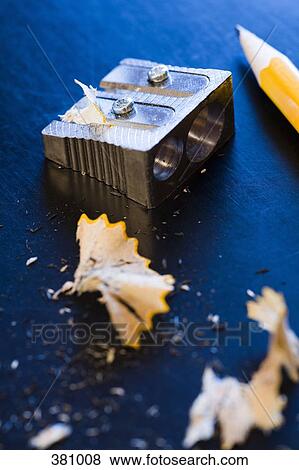 Stock Photo - Pencil sharpener, shavings and pencil on a desk. Fotosearch