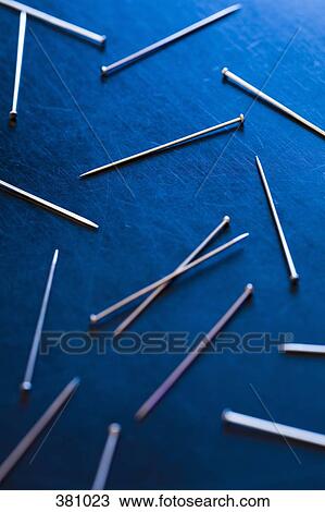 Silver pins on a desk View Large Photo Image Stock Image - Silver pins on a desk. Fotosearch