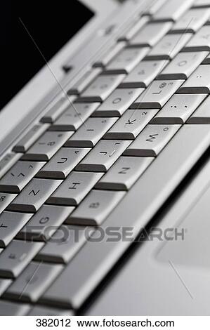 Close-up of silver laptop View Large Photo Image Stock Image - Close-up of silver laptop. Fotosearch