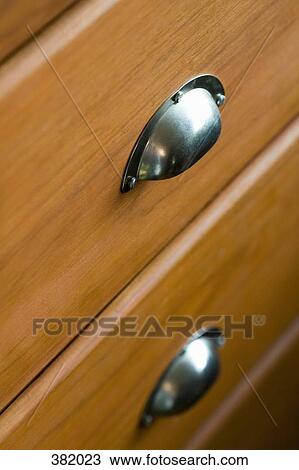 Stock Image - Close-up of wooden drawers. Fotosearch