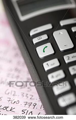 Midsection of mobile phone keypad View Large Photo Image Stock Photo - Midsection of mobile phone keypad. Fotosearch