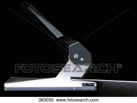 Document in a hole puncher View Large Photo Image Stock Photography - Document in a hole puncher. Fotosearch