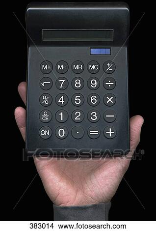 Picture - Man holding a calculator. Fotosearch