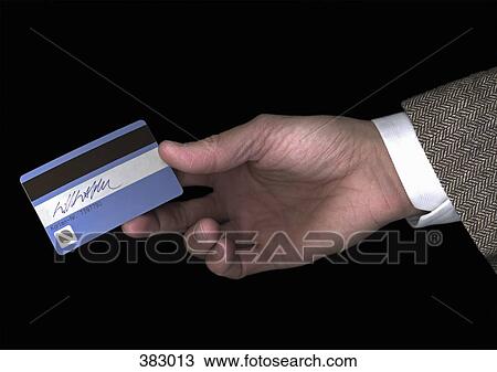 Man holding a credit card View Large Photo Image Stock Image - Man holding a credit card. Fotosearch