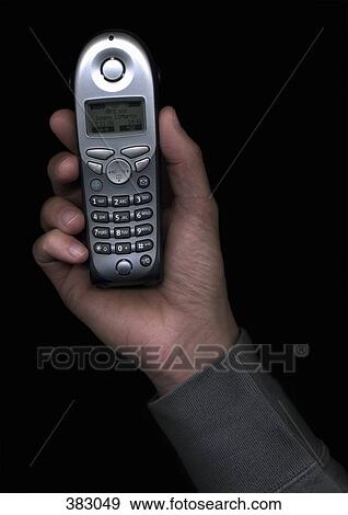 Man holding a telephone receiver View Large Photo Image Stock Photo - Man holding a telephone receiver. Fotosearch