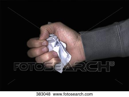 Stock Photo - Man holding crumpled paper. Fotosearch