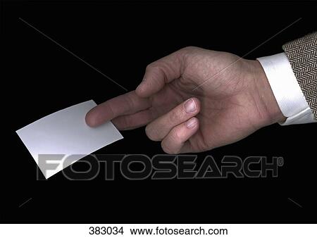 Picture - Man offering a business card. Fotosearch