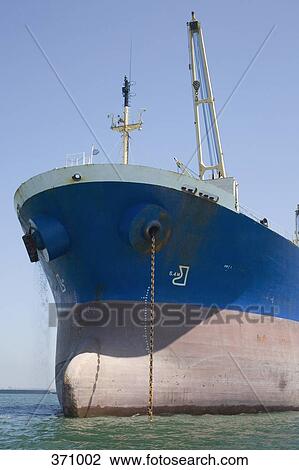 Cargo ship moored in a harbor View Large Photo Image Stock Image - Cargo ship moored in a harbor. Fotosearch