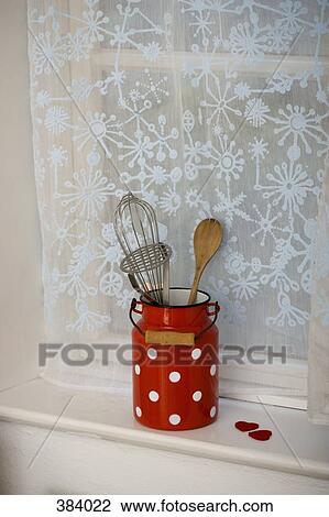 Stock Image - Kitchen utensils on a window sill. Fotosearch