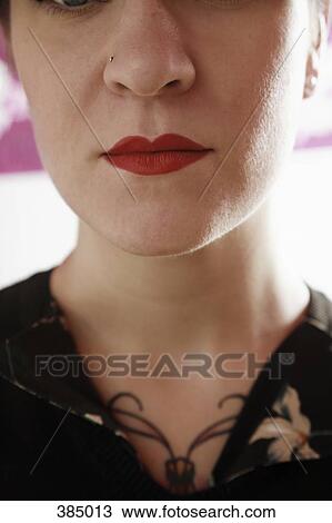Close up of a young woman with red lipstick View Large Photo Image Stock Image - Close up of a young woman with red lipstick. Fotosearch