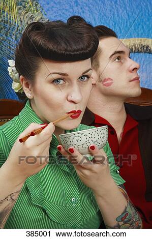 Close up of young rockabilly, woman holding soup bowl and chopsticks View Large Photo Image Stock Image - Close up of young rockabilly, woman holding soup bowl and chopsticks. Fotosearch
