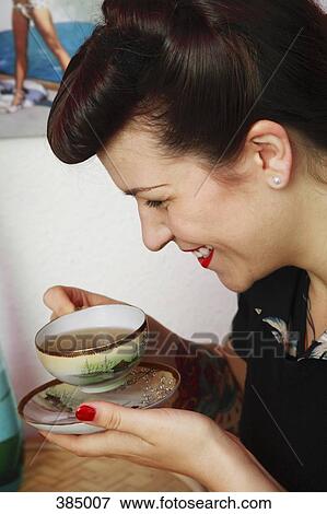 Woman drinking tea View Large Photo Image Stock Photo - Woman drinking tea. Fotosearch