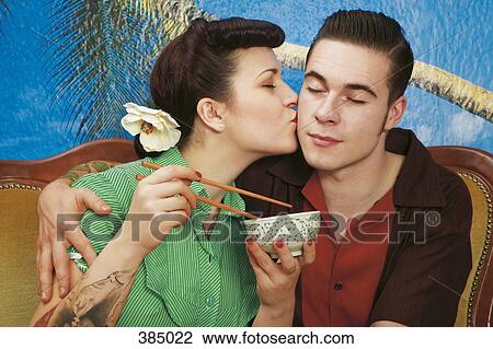 Woman kissing her boyfriend View Large Photo Image Stock Image - Woman kissing her boyfriend. Fotosearch