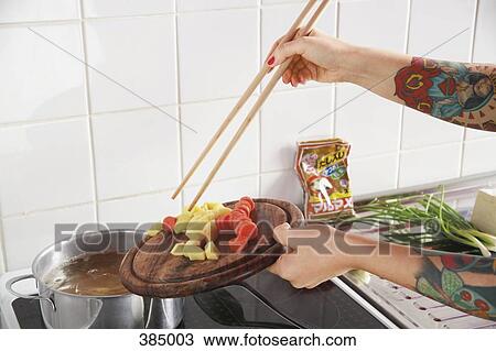 Woman with tattooed arms preparing vegetables View Large Photo Image Stock Image - Woman with tattooed arms preparing vegetables. Fotosearch